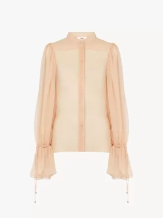Blusa con maniche a sbuffo in mousseline di seta