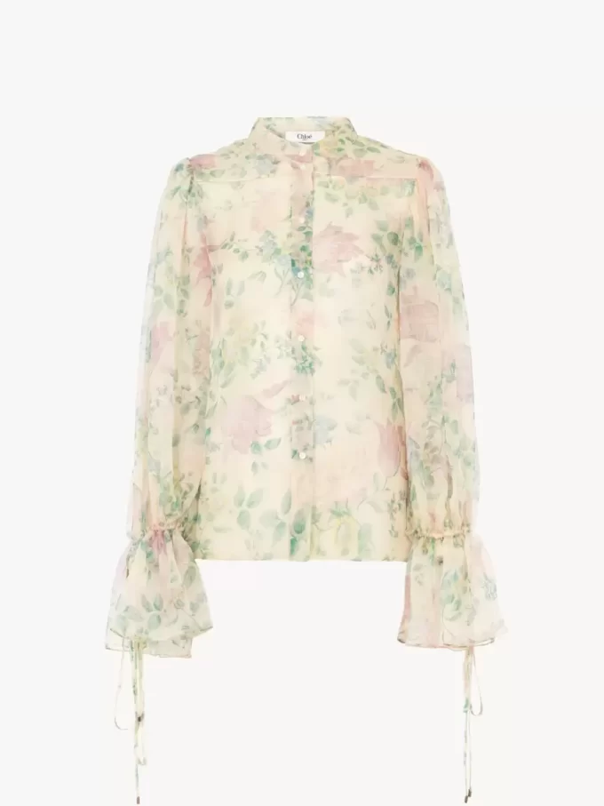 Blusa con maniche a sbuffo in mousseline di seta Blusa con maniche a sbuffo in mousseline di seta