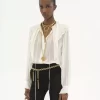 Blusa con volant in georgette di seta Blusa con volant in georgette di seta