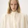 Blusa oversize con volant in jacquard di seta Blusa oversize con volant in jacquard di seta