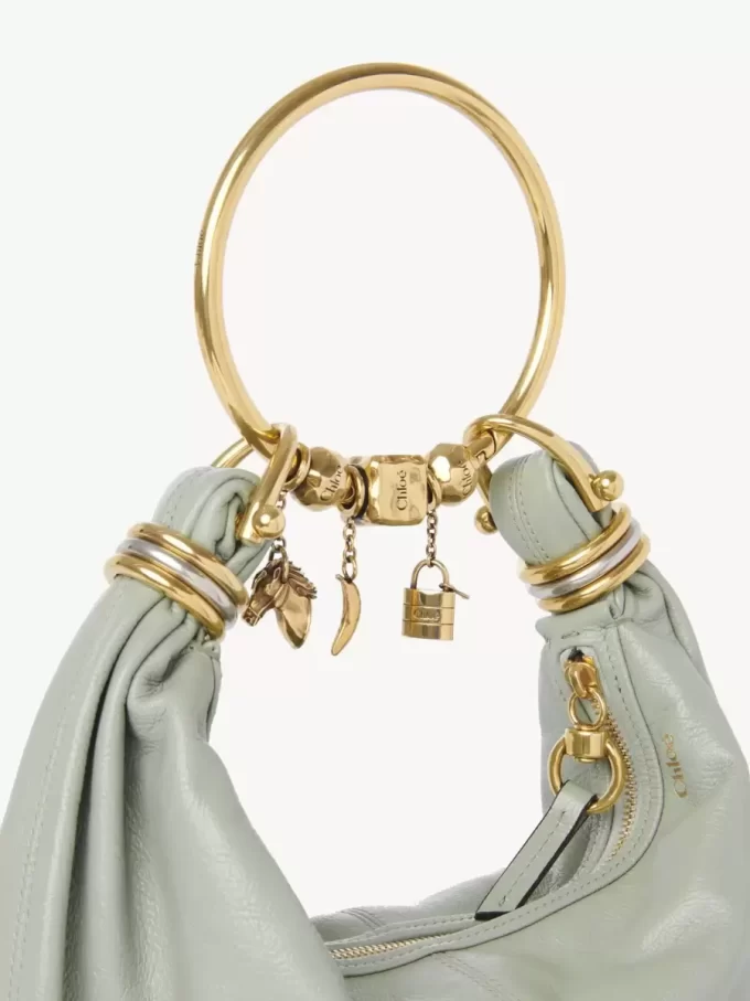 Borsa Hobo piccola con bracciale in pelle martellata Borsa Hobo piccola con bracciale in pelle martellata