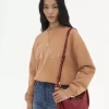 Borsa Hobo piccola con bracciale in pelle martellata Borsa Hobo piccola con bracciale in pelle martellata