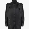 Cappotto in pelle con collo alto e arricciature Cappotto in pelle con collo alto e arricciature