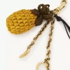 Ciondolo per borsa a forma di ananas in rafia, metallo e pelle Ciondolo per borsa a forma di ananas in rafia, metallo e pelle