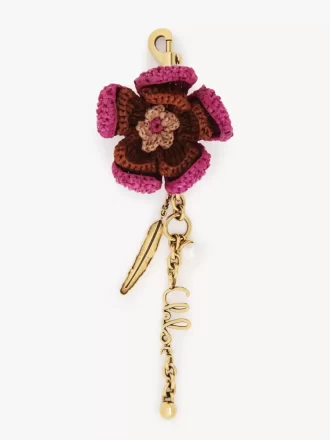 Ciondolo per borsa a forma di fiore in rafia e metallo