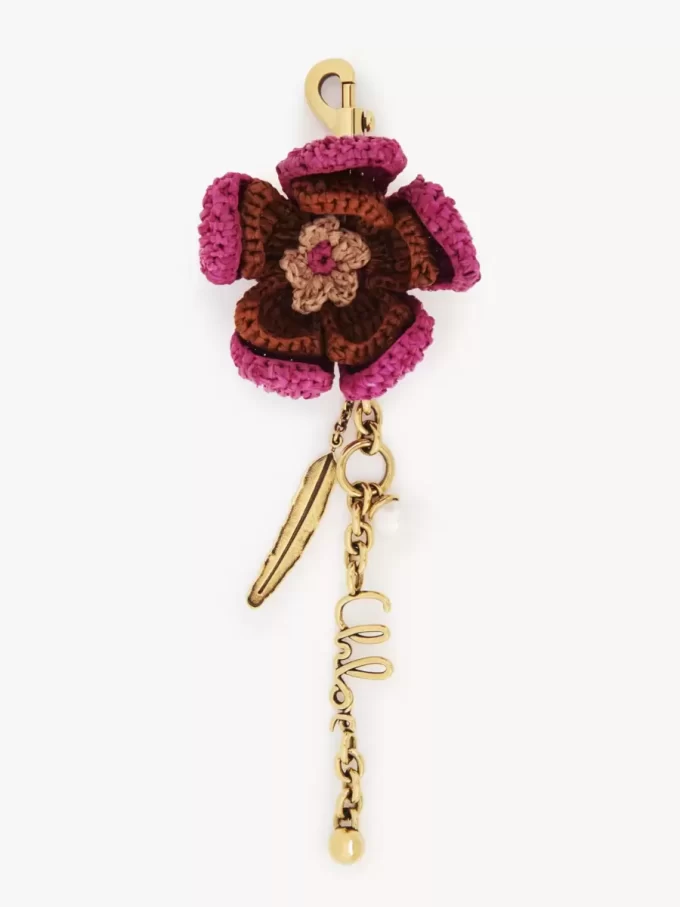 Ciondolo per borsa a forma di fiore in rafia e metallo Ciondolo per borsa a forma di fiore in rafia e metallo