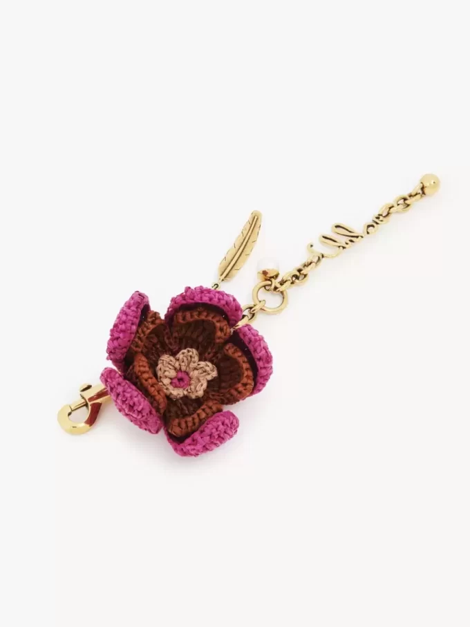 Ciondolo per borsa a forma di fiore in rafia e metallo Ciondolo per borsa a forma di fiore in rafia e metallo
