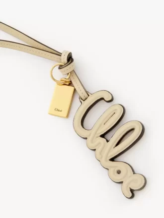 Ciondolo per borsa con logo in pelle lucida