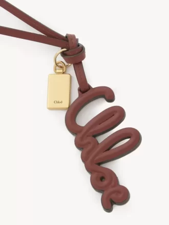 Ciondolo per borsa con logo in pelle lucida