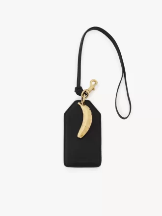 Etichetta a forma di banana in pelle lucida Etichetta a forma di banana in pelle lucida