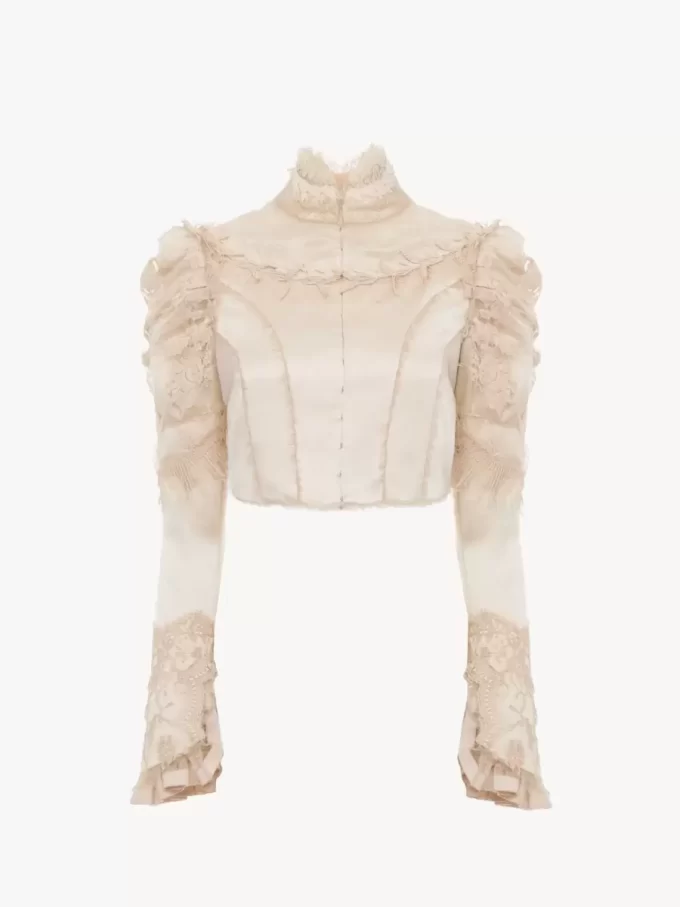 Giacca corta e aderente in raso duchesse di seta e pizzo Giacca corta e aderente in raso duchesse di seta e pizzo