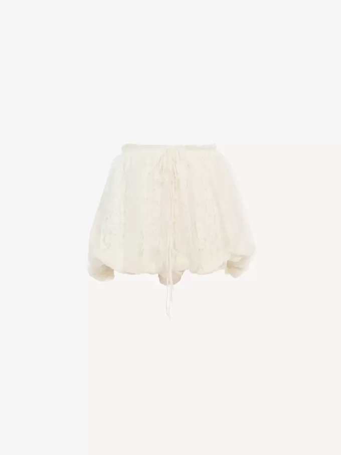 Mini shorts a campana in mousseline di seta con pizzo floreale Mini shorts a campana in mousseline di seta con pizzo floreale