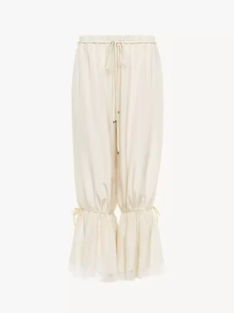 Pantaloni corti fluidi in seta pongé lavata e pizzo