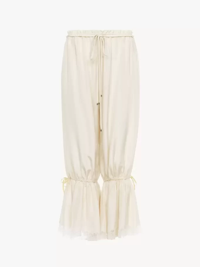 Pantaloni corti fluidi in seta pongé lavata e pizzo Pantaloni corti fluidi in seta pongé lavata e pizzo