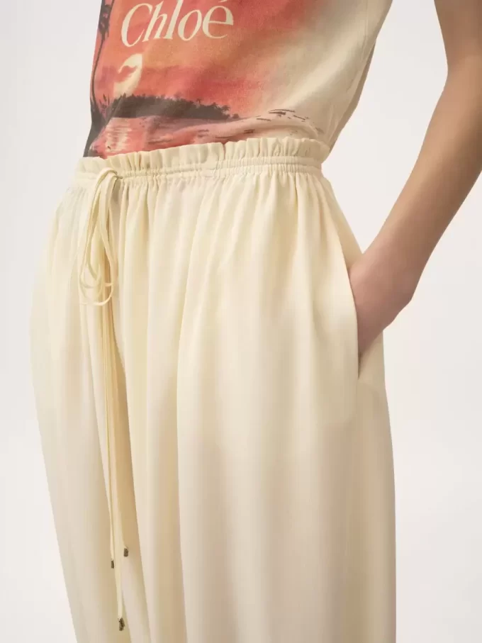Pantaloni fluidi cropped in crêpe de chine Pantaloni fluidi cropped in crêpe de chine