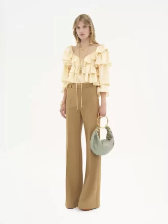 Pantaloni sartoriali svasati in lana grain de poudre