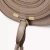 Piccola borsa a sella Marcie in pelle lucida Piccola borsa a sella Marcie in pelle lucida