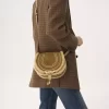 Piccola borsa a tracolla Marcie in pelle scamosciata e shearling Piccola borsa a tracolla Marcie in pelle scamosciata e shearling