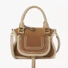 Piccola borsa Marcie in pelle scamosciata e shearling Piccola borsa Marcie in pelle scamosciata e shearling