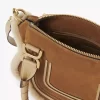 Piccola borsa Marcie in pelle scamosciata e shearling Piccola borsa Marcie in pelle scamosciata e shearling