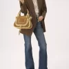Piccola borsa Marcie in pelle scamosciata e shearling Piccola borsa Marcie in pelle scamosciata e shearling