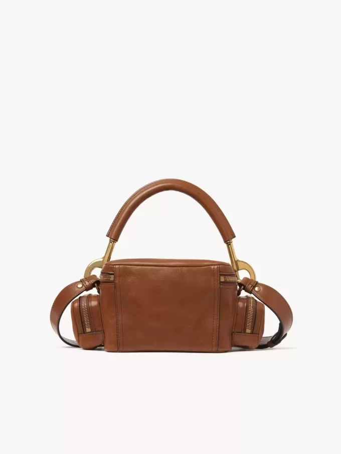 Piccola borsa per macchina fotografica in pelle lucida Piccola borsa per macchina fotografica in pelle lucida