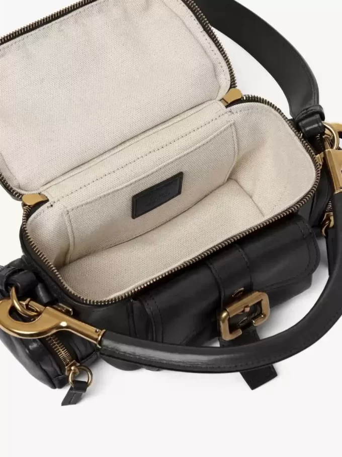 Piccola borsa per macchina fotografica in pelle lucida Piccola borsa per macchina fotografica in pelle lucida