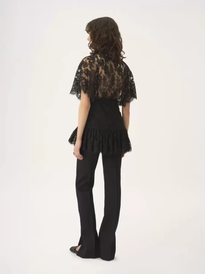 Top aderente con volant in pizzo Top aderente con volant in pizzo