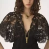 Top aderente con volant in pizzo Top aderente con volant in pizzo